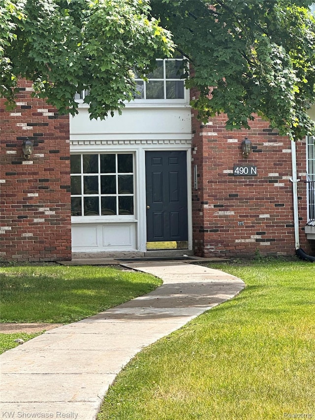 490 N Fox Hills Dr N Unit 2, Bloomfield Hills, MI 48304 - property entrance with a yard and brick siding