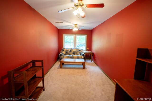 3485 Burrus Ct, Ortonville, MI 48462 - carpeted living area with a ceiling fan and vaulted ceiling