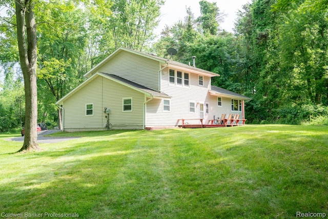 3485 Burrus Ct, Ortonville, MI 48462 - back of house with a yard and a wooden deck