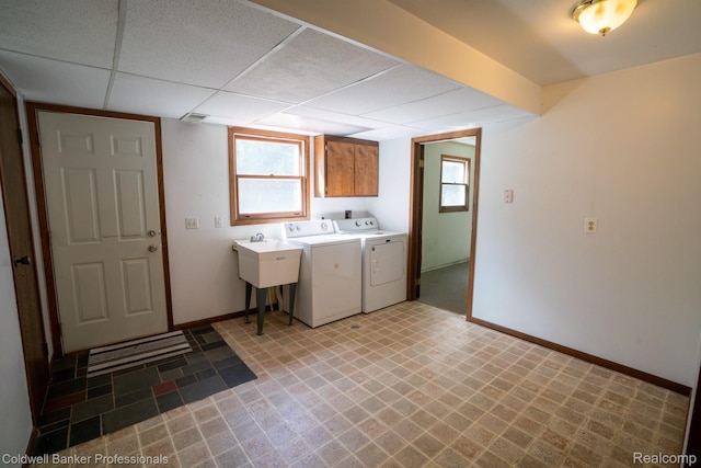 3485 Burrus Ct, Ortonville, MI 48462 - washroom featuring washer and dryer, cabinet space, and light flooring