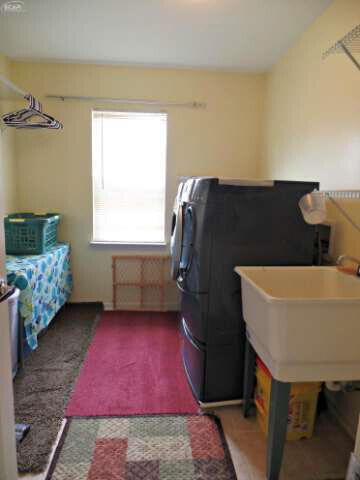 6296 Moonstone Dr, Grand Blanc, MI 48439 - laundry room with washer and dryer