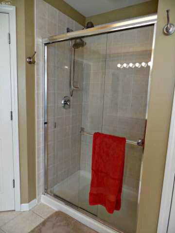 6296 Moonstone Dr, Grand Blanc, MI 48439 - bathroom with a shower stall and tile patterned floors