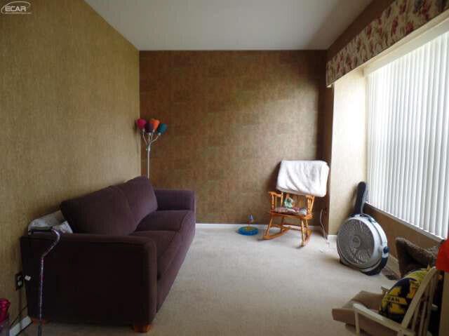 6296 Moonstone Dr, Grand Blanc, MI 48439 - sitting room with plenty of natural light, wallpapered walls, and carpet