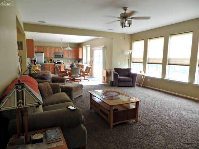 6296 Moonstone Dr, Grand Blanc, MI 48439 - living area with a ceiling fan and carpet flooring