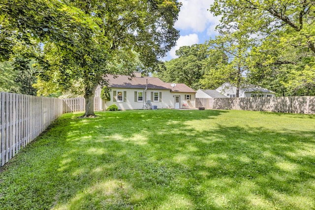 1603 Park Rd, Jackson, MI 49203 - back of house featuring a fenced backyard and a chimney