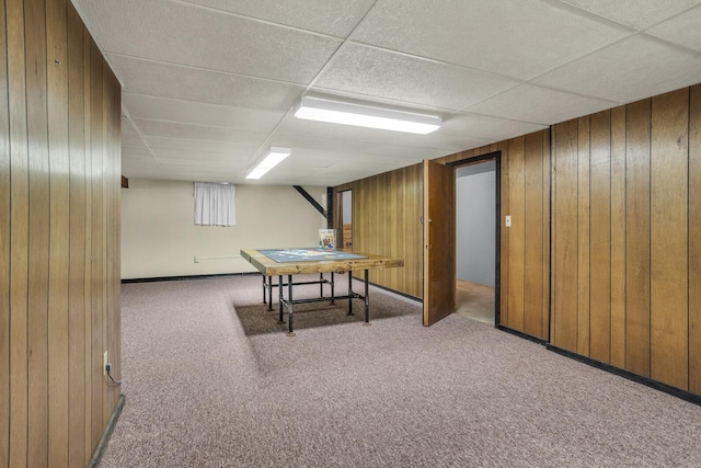 1603 Park Rd, Jackson, MI 49203 - rec room with carpet floors, a paneled ceiling, and wood walls