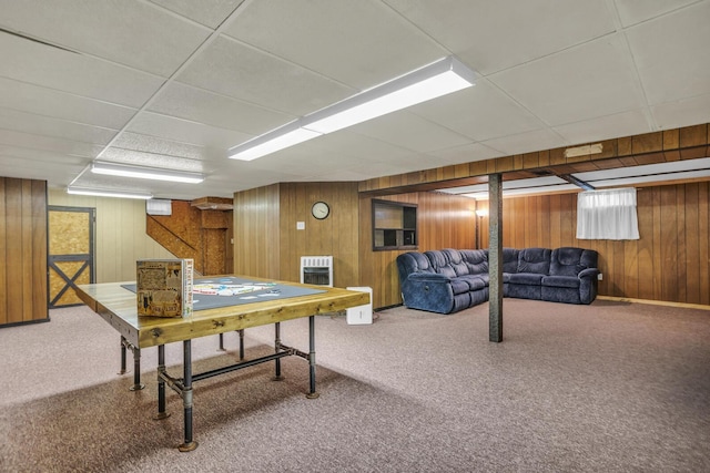 1603 Park Rd, Jackson, MI 49203 - recreation room with carpet, wooden walls, heating unit, and a paneled ceiling