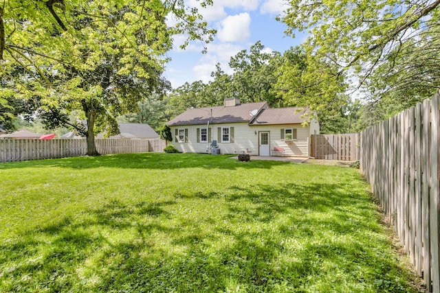 1603 Park Rd, Jackson, MI 49203 - back of house with a fenced backyard and a patio area