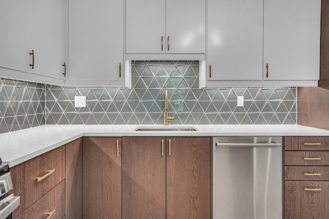 1603 Park Rd, Jackson, MI 49203 - kitchen featuring stainless steel dishwasher, white cabinetry, and light countertops