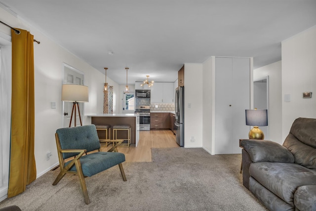 1603 Park Rd, Jackson, MI 49203 - living area with light colored carpet and a chandelier