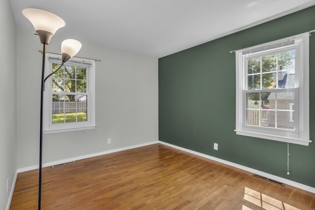 1603 Park Rd, Jackson, MI 49203 - empty room with plenty of natural light and wood finished floors