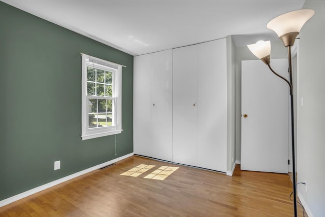 1603 Park Rd, Jackson, MI 49203 - unfurnished bedroom with wood finished floors and a closet