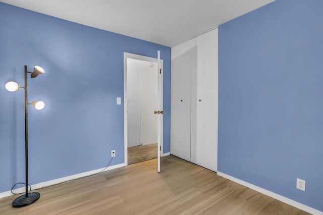 1603 Park Rd, Jackson, MI 49203 - unfurnished bedroom with wood finished floors and a closet
