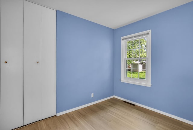 1603 Park Rd, Jackson, MI 49203 - unfurnished bedroom with wood finished floors and a closet