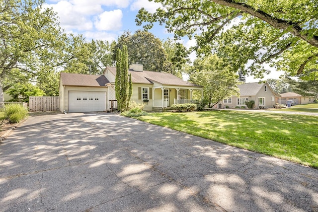 1603 Park Rd, Jackson, MI 49203 - view of front of house with covered porch, driveway, and a garage