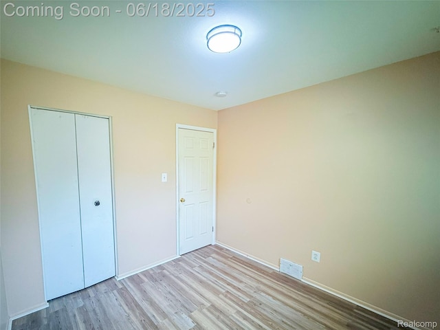32303 Glen St, Westland, MI 48186 - unfurnished bedroom with wood finished floors and a closet