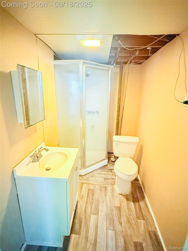 32303 Glen St, Westland, MI 48186 - bathroom with a stall shower, vanity, and wood finished floors