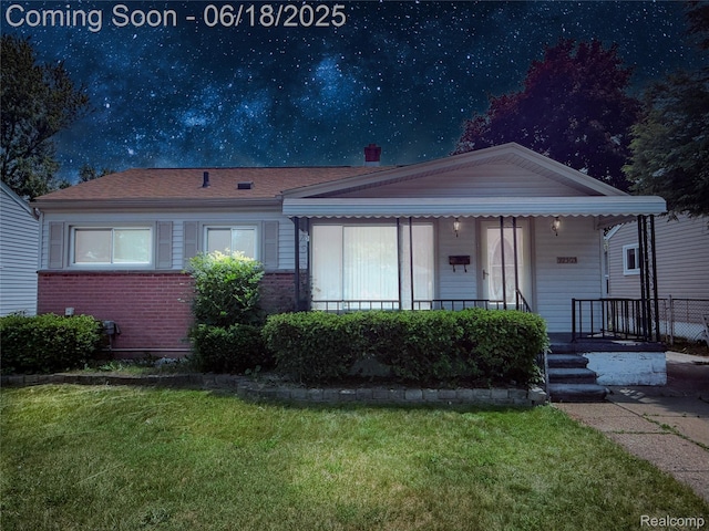 32303 Glen St, Westland, MI 48186 - view of front of house with a front lawn, a porch, and brick siding