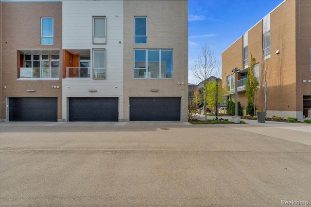 248 Alfred St, Detroit, MI 48201 - view of building exterior with a garage