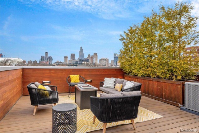 248 Alfred St, Detroit, MI 48201 - wooden terrace featuring outdoor lounge area and a view of skyline
