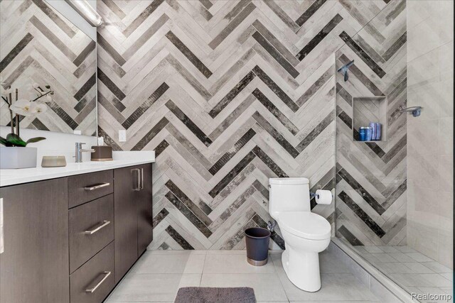 248 Alfred St, Detroit, MI 48201 - full bathroom featuring vanity, a tile shower, and tile patterned floors