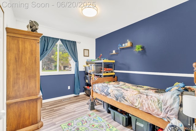 312 Airport Dr, Holly, MI 48442 - bedroom with wood finished floors and baseboards