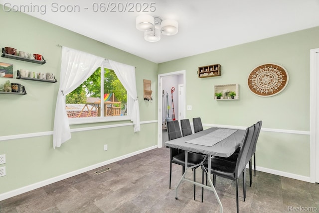 312 Airport Dr, Holly, MI 48442 - dining room with baseboards
