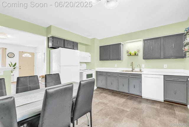 312 Airport Dr, Holly, MI 48442 - kitchen featuring white appliances, gray cabinetry, and light countertops