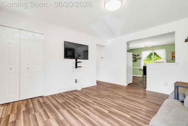 312 Airport Dr, Holly, MI 48442 - living room featuring wood finished floors