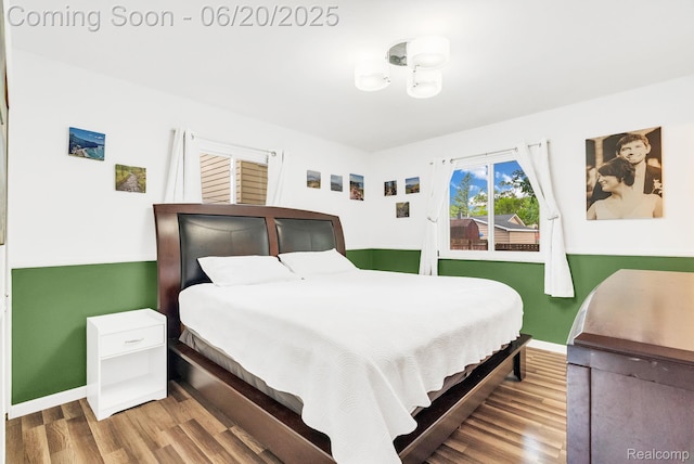 312 Airport Dr, Holly, MI 48442 - bedroom featuring wood finished floors