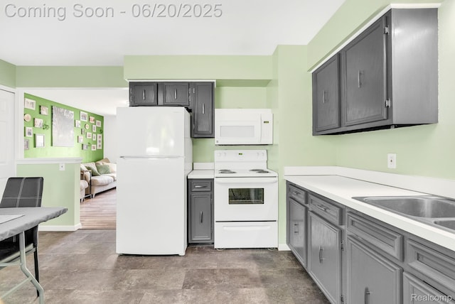 312 Airport Dr, Holly, MI 48442 - kitchen featuring white appliances, gray cabinetry, and light countertops