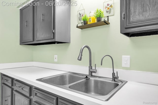 312 Airport Dr, Holly, MI 48442 - kitchen with gray cabinetry and light countertops