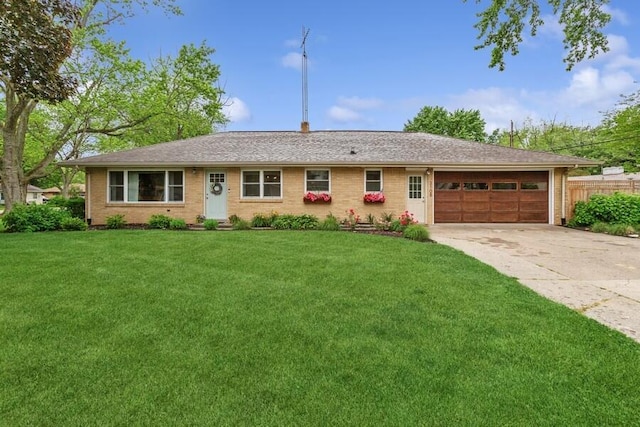 3108 Kim St, Saint Joseph, MI 49085 - ranch-style house with concrete driveway, an attached garage, and brick siding