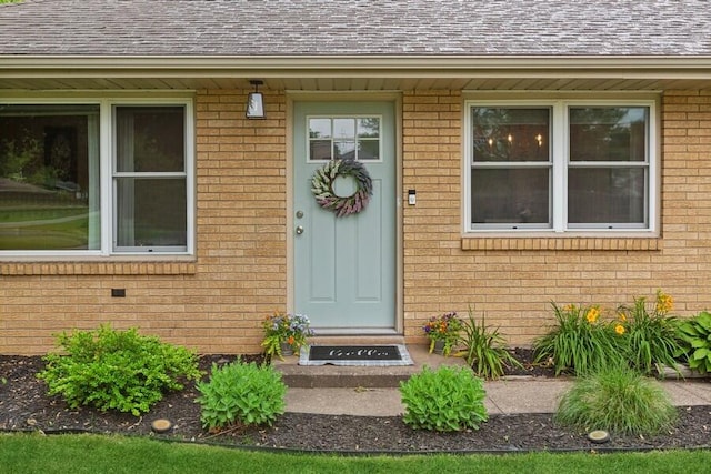 3108 Kim St, Saint Joseph, MI 49085 - property entrance with brick siding and roof with shingles