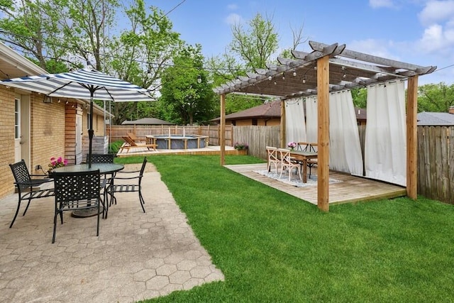 3108 Kim St, Saint Joseph, MI 49085 - fenced backyard featuring outdoor dining space, a pergola, a patio, and a jacuzzi