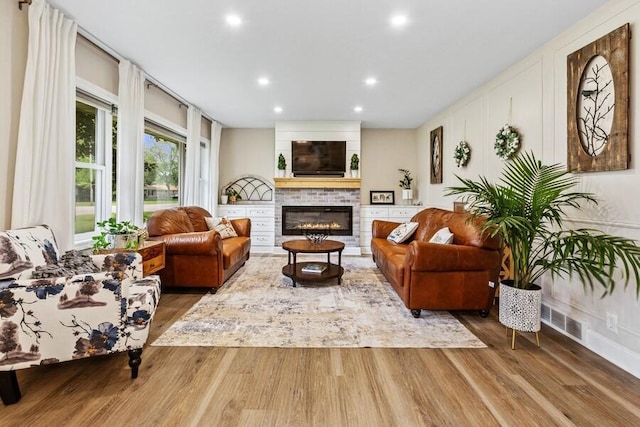 3108 Kim St, Saint Joseph, MI 49085 - living area featuring wood finished floors, recessed lighting, and a fireplace