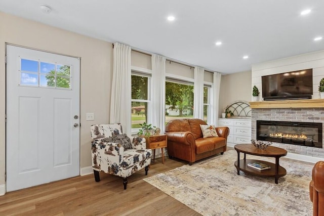3108 Kim St, Saint Joseph, MI 49085 - living area featuring wood finished floors, recessed lighting, and a fireplace