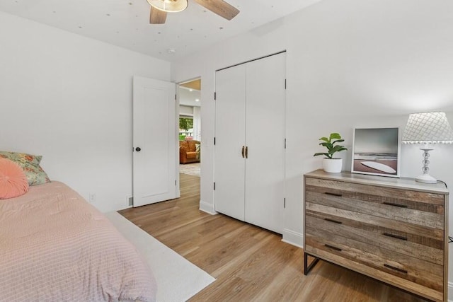 3108 Kim St, Saint Joseph, MI 49085 - bedroom featuring light wood finished floors, a ceiling fan, and a closet