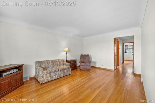 6514 Maple St, Dearborn, MI 48126 - sitting room featuring light wood-style floors and baseboards