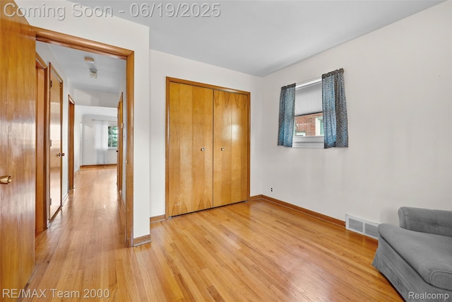 6514 Maple St, Dearborn, MI 48126 - unfurnished bedroom with light wood-type flooring and a closet