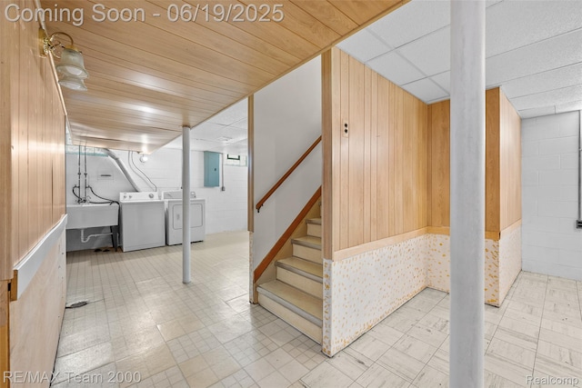6514 Maple St, Dearborn, MI 48126 - finished basement featuring washing machine and dryer, electric panel, tile patterned floors, wooden walls, and stairs