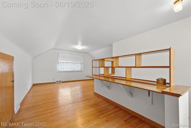 6514 Maple St, Dearborn, MI 48126 - additional living space featuring vaulted ceiling and light wood-style flooring