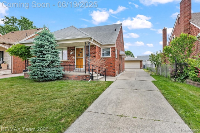 6514 Maple St, Dearborn, MI 48126 - view of front of house with brick siding, roof with shingles, and a garage