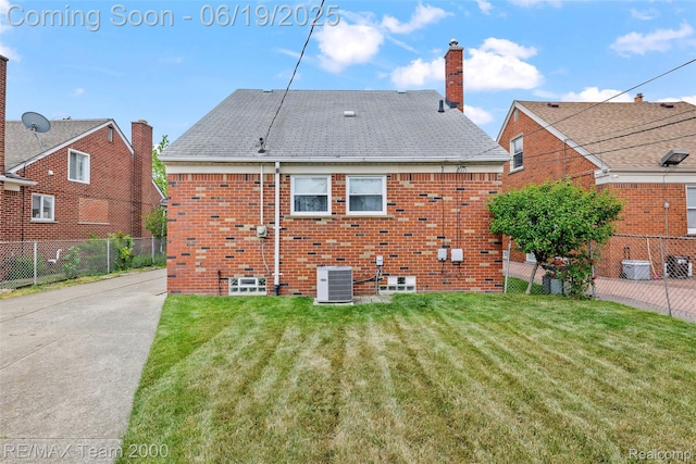 6514 Maple St, Dearborn, MI 48126 - rear view of property featuring brick siding and a chimney