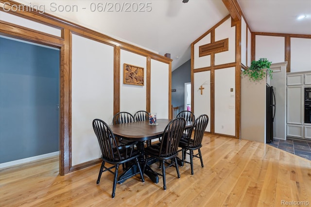 2386 Sherlock Trl, Highland, MI 48356 - dining space with lofted ceiling and wood finished floors