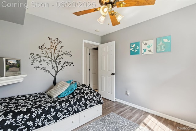 2386 Sherlock Trl, Highland, MI 48356 - bedroom with wood finished floors and ceiling fan