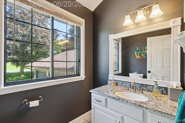 2386 Sherlock Trl, Highland, MI 48356 - bathroom with vanity and baseboards