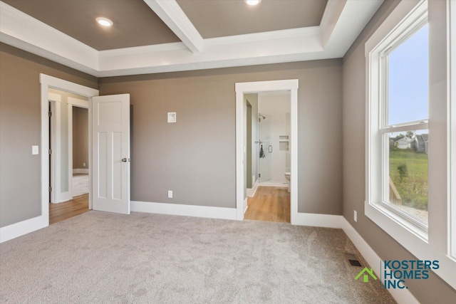 1827 Stratford Ln NW, Grand Rapids, MI 49534 - unfurnished bedroom with light colored carpet, multiple windows, recessed lighting, and connected bathroom