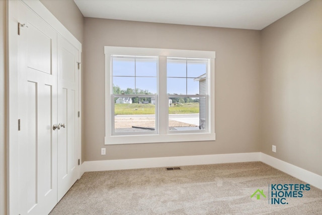 1827 Stratford Ln NW, Grand Rapids, MI 49534 - unfurnished bedroom with carpet floors and a closet