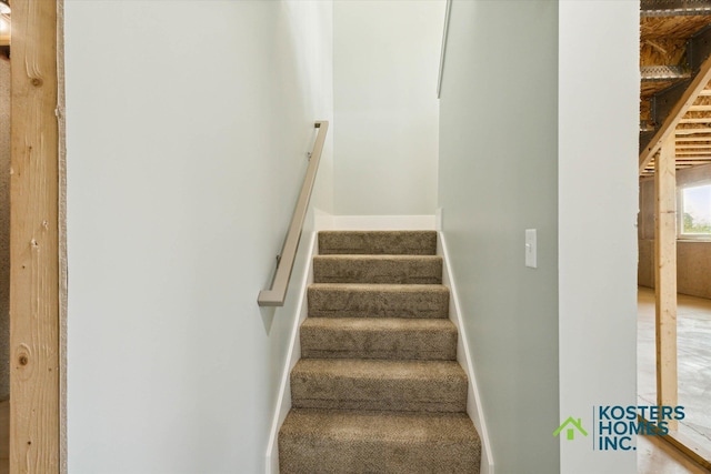 1827 Stratford Ln NW, Grand Rapids, MI 49534 - staircase featuring baseboards